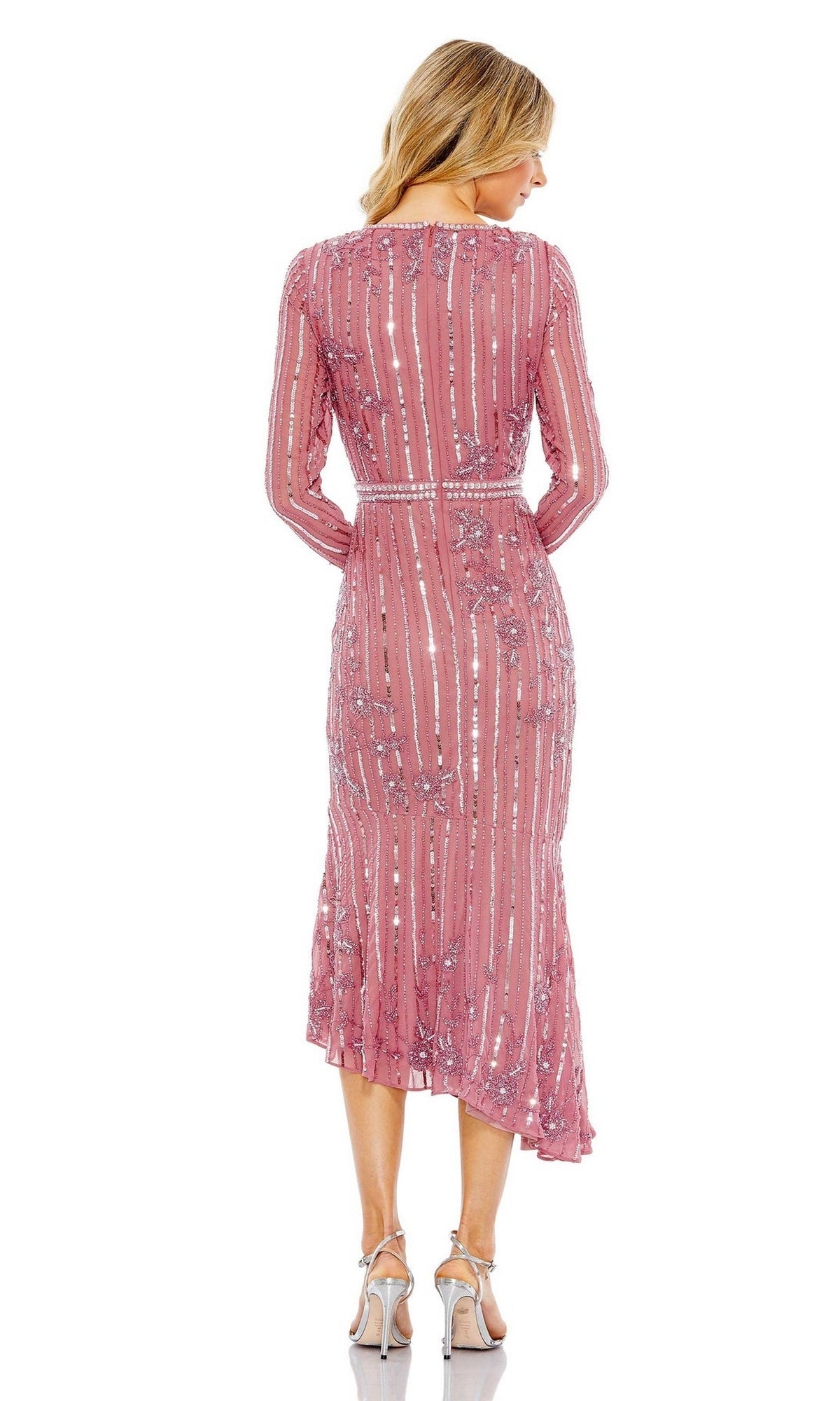 A woman stands with her back to the camera wearing the Mac Duggal 93627 Midi Sequin Wedding Guest Dress in pink and silver high-heeled sandals, set against a plain white background.